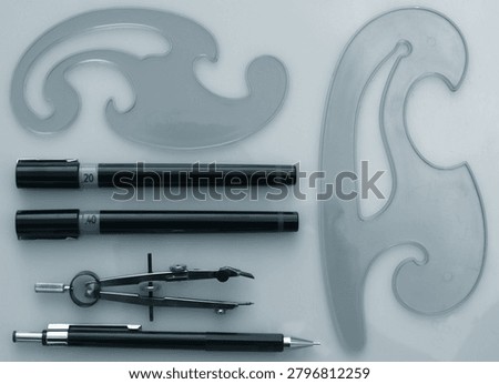 Professional Technical Drawing Tools Layout with French Curves and Precision Pens for Engineering Design   