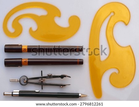 Professional Technical Drawing Tools Layout with French Curves and Precision Pens for Engineering Design   