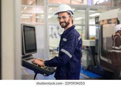 Professional technician checking part of automatic machine at factory - Powered by Shutterstock