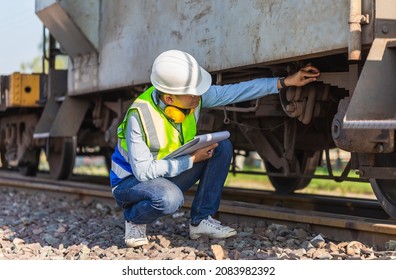 Professional Technician Pre-check Freight Trains, Engineer Man Working In Cargo Train Platform, Technician Controls The Correctness Of The Freight Car, Safety Concepts