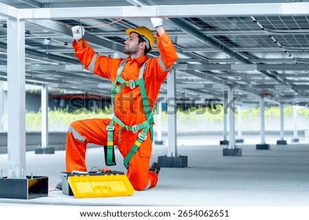 Professional technician worker or engineer work with maintenance or check system under solarcell panel.