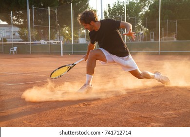 Professional tennis player man playing on court in afternoon.  