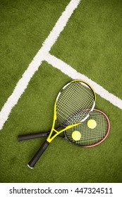 Professional tennis racquets on lawn