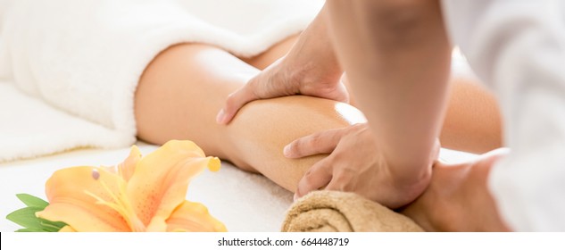 Professional Therapist Giving Traditional Thai Oil Massage To A Woman In Spa - Panoramic Banner