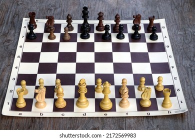 A Professional Tournament Chess Board With The 32 Chess Game Pieces Placed Before The Start Of A Game