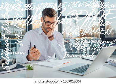 Professional Translator In Eyeglasses Working Online With Laptop, Welcome Translation Illustration