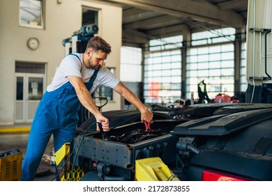 Professional Truck Mechanic Working In Vehicle Repair Service.
