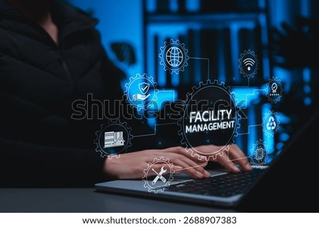 Professional using digital facility management system on laptop, representing smart building maintenance, infrastructure operations, sustainability, safety, and property technology solutions.
