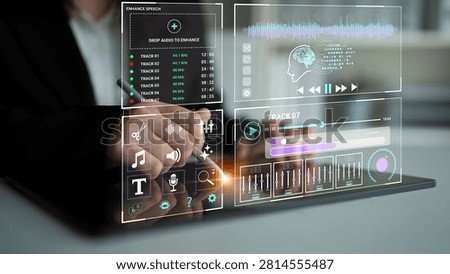 A professional utilizes advanced interactive technology for audio editing, showcasing a modern workspace with dynamic visual feedback and innovative design elements.