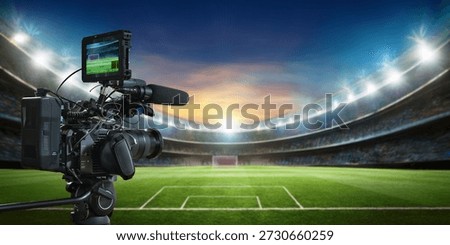 Professional video camera filming with empty football stadium background for live broadcast sport event mock up with copy space