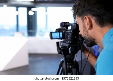 Professional Video Camera Operator Working In Studio, Closeup