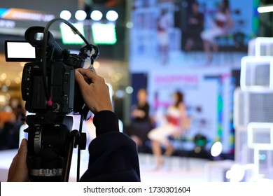 Professional Video Production Camera Recording Live Event On Stage. Television Social Media Broadcasting Seminar Conference.