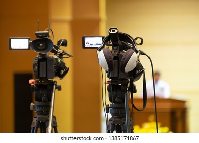 Professional Videographer Recording Seminar Meeting with Professional Camcoder and Boardcasting.