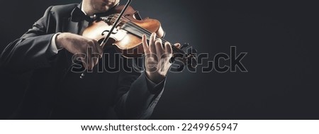 Professional violin player performing, classical music concept, banner with copy space