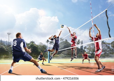 Professional volleyball players in action on the court