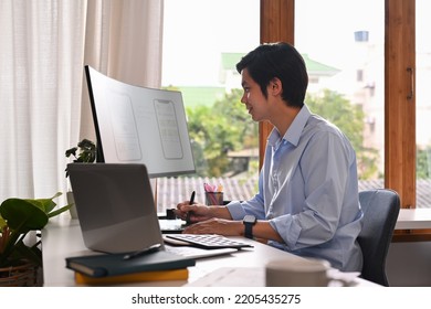 Professional Web Developer Working With Prototype Wireframe For Web Mobile Phone On Computer Screen