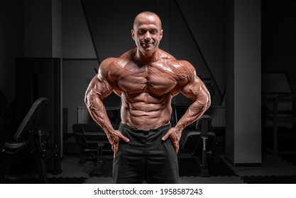 Professional Weightlifter Posing In The Gym. Classic Bodybuilding. Mixed Media