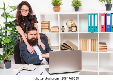 Professional Woman Embrace Man Working On Laptop In Office, Workplace Romance