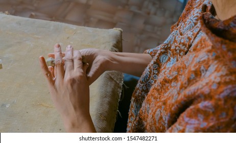 Professional woman potter making ceramic souvenir penny whistle toy bird in pottery workshop, studio. Crafting, artwork and handmade concept - Powered by Shutterstock