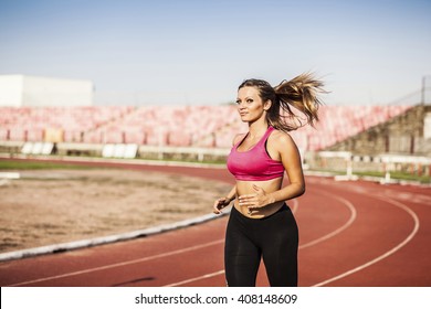 Professional women athlete on the track. - Powered by Shutterstock