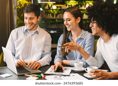 Professional work colleagues meeting up and drinking coffee, discussing business strategy at cafe during lunch, free space - Powered by Shutterstock