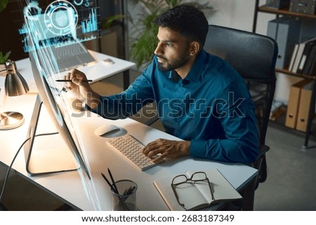 Professional Worker Analyzing Data On A Computer In A Modern Office Environment. Technology, Innovation, And Productivity Concepts. Man Utilizing Advanced Tools For Business Analysis 