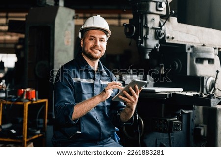 Professional worker of manufacturing plant factory. Engineer working with machine Maintenance machine, mechanical engineering portrait working teamwork.