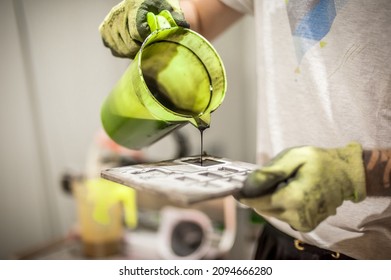 Professional worker technician work with soft PVC liquid rubber in mold in factory production workplace. Manufacture working operating process - Powered by Shutterstock