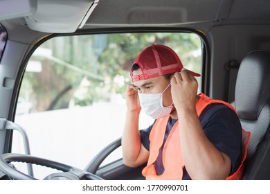 Professional Worker, Truck Driver, Middle-aged Asian Man Wearing Protective Mask And Safety Vests For A Long Transportation Business