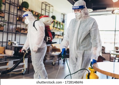 Professional Workers In Hazmat Suits Disinfecting Indoor Of Cafe Or Restaurant, Pandemic Health Risk, Coronavirus