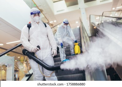 Professional Workers In Hazmat Suits Disinfecting Indoor Of Mall, Pandemic Health Risk, Coronavirus