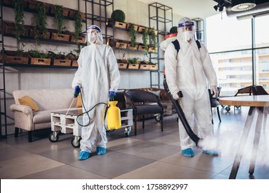 Professional Workers In Hazmat Suits Disinfecting Indoor Of Cafe Or Restaurant, Pandemic Health Risk, Coronavirus