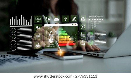 A professional workspace showcasing energy efficiency analysis using digital tools. Visual data elements, graphs, and indicators highlight sustainable energy solutions and strategies. Ledger
