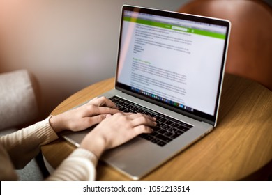 Professional Writer Keyboarding Promotional Text On Laptop Computer While Sitting In Coworking Space. Woman Successful Freelancer Typing Text On Notebook. Business Person Using Netbook For Chat 