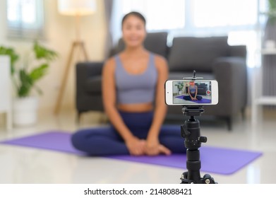 A Professional Yoga Coach Teaching Online Training Class To Students During Live Streaming On Social Media, Healthcare Concept