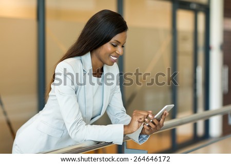 professional young african career woman using smart phone