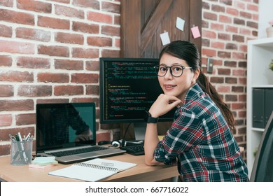 Professional Young Woman Computer Engineer Using Code Language Development Online Safety Software Work In Office And Looking At Camera.