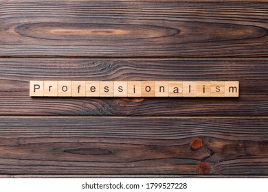 Professionalism word written on wood block. Professionalism text on cement table for your desing, concept.
