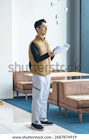 Professionals checking the work with blueprints