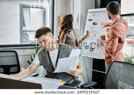Professionals engage in serious discussions while dressed elegantly in a modern office.