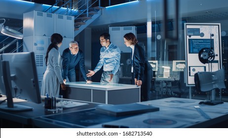 Professionals Meeting in Virtual Reality Content Design Creative Lab: Engineers, Scientists and Game / App Developers Gathered Around Illuminated Interactive Table. Specialists Talking, Gesticulating - Shutterstock ID 1682713540
