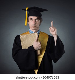 Professor In The Academic Dress With Big Old Book In Her Hands.