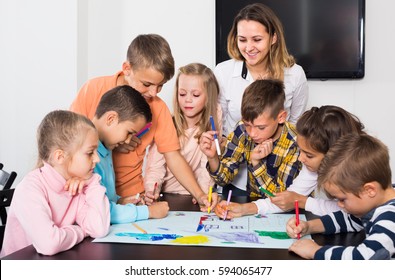 Professor Elementary Age Children Drawing Together Stock Photo (Edit ...