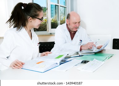 Professor And PhD Or Master Course Student Discuss  Her Scientific Project