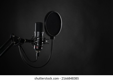 Proffesional studio microphone, isolated on the black background. Podcasts and music recording. - Powered by Shutterstock