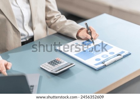 Proficient Asian businesswoman specializing in credit management. Skilled in navigating credit bureaus, analyzing APRs, managing balances, and optimizing credit card usage for financial goals.