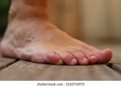 Profil Of A Right Foot, Light Skinned, Slightly Tanned Feet Seen From The Side