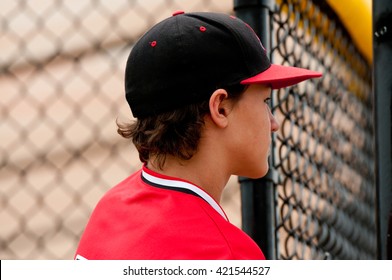 Profile Of American Baseball Player Close Up In The Dugout.