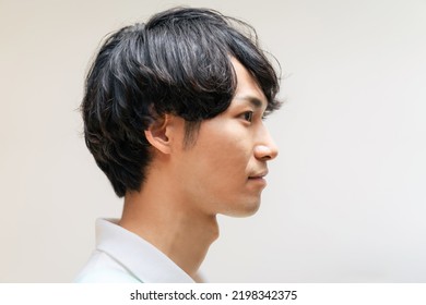 Profile of Asian man. Portrait. Side view.