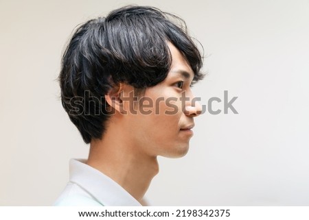 Profile of Asian man. Portrait. Side view.